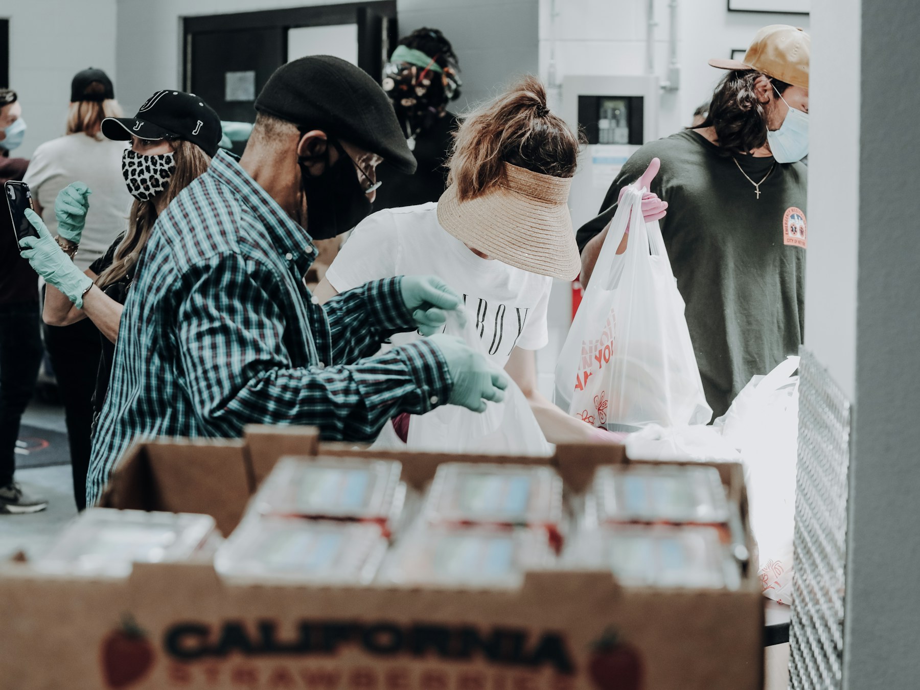 Volunteers sorting food donations at a community distribution site